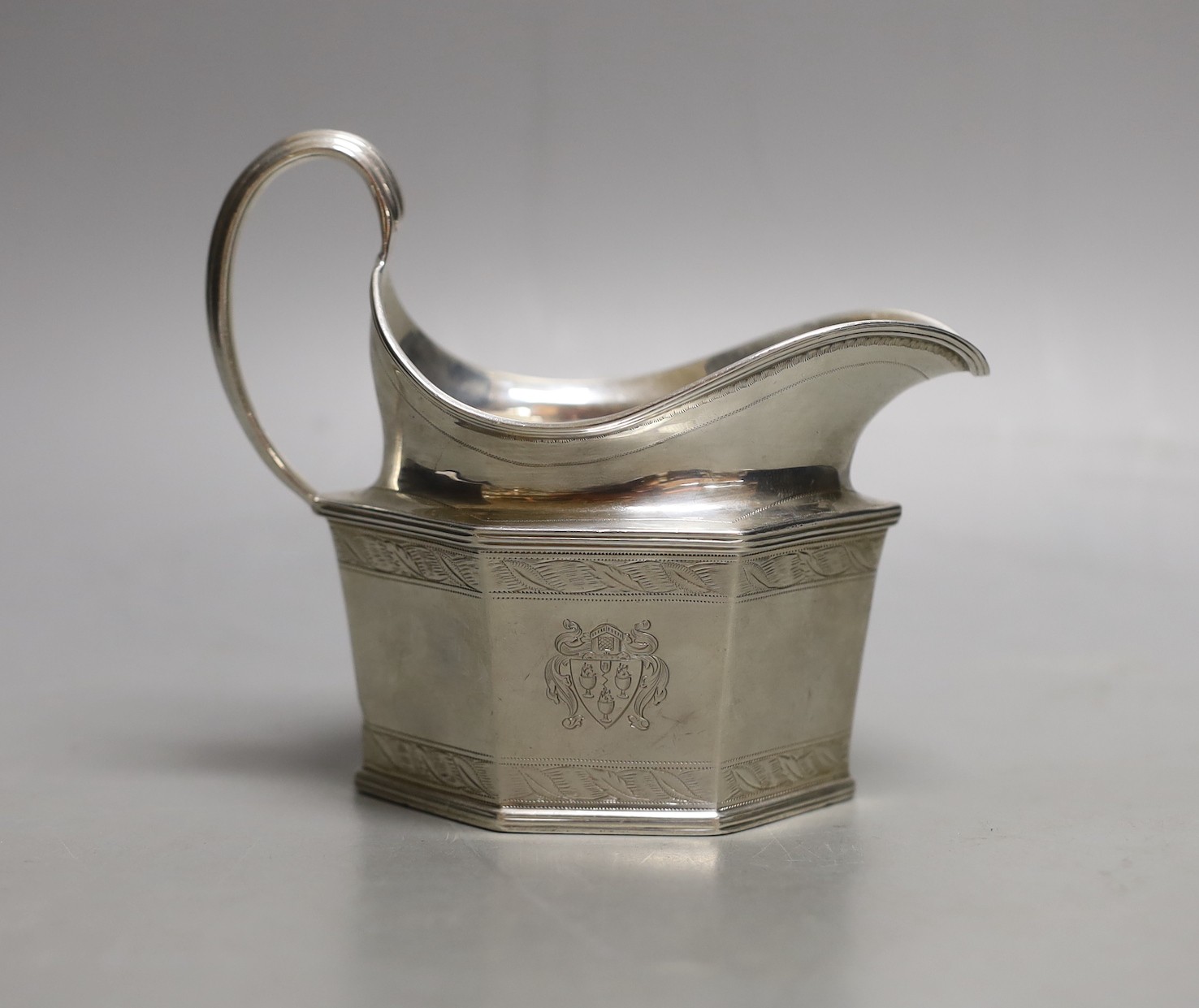 A George V silver hexagonal cream jug, London, 1930, 7oz.